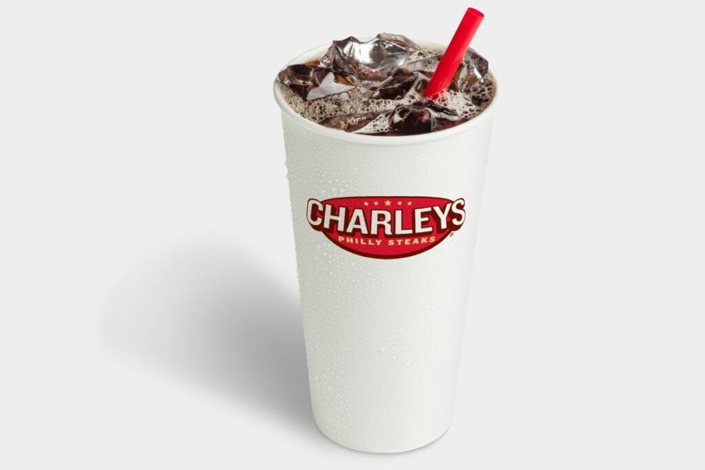 Charleys Coca-Cola soft drink in a white cup with a red straw and Charleys logo on the front.