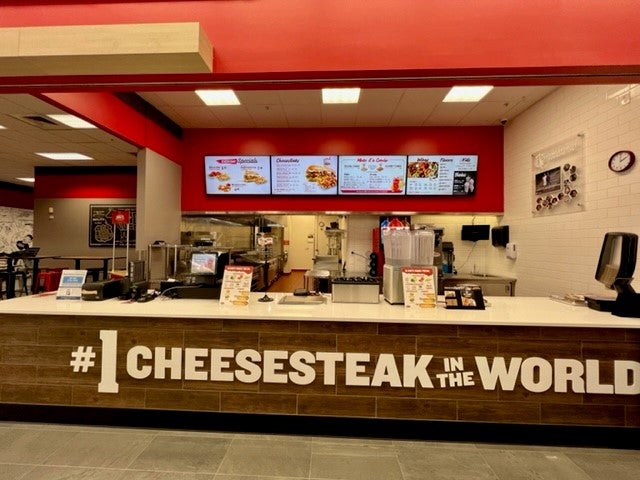 The ordering station and cash registers at Charleys Cheesesteaks and Wings.