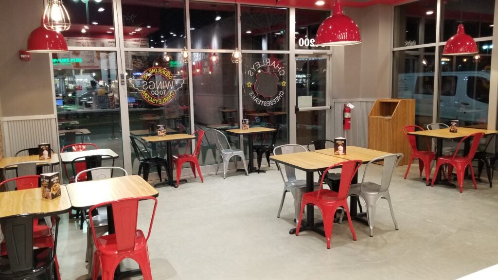 Tables and chairs in the dining area at Charleys Cheesesteaks and Wings in Solon, OH.