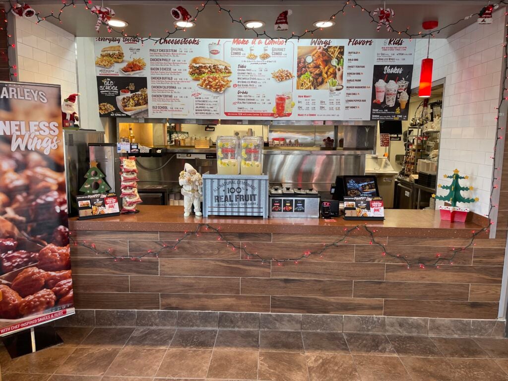 The front counter and menu at Charleys Cheesesteaks and Wings Marion Mt. Gilead Rd. in Marion, OH during the grand opening in December 2022.