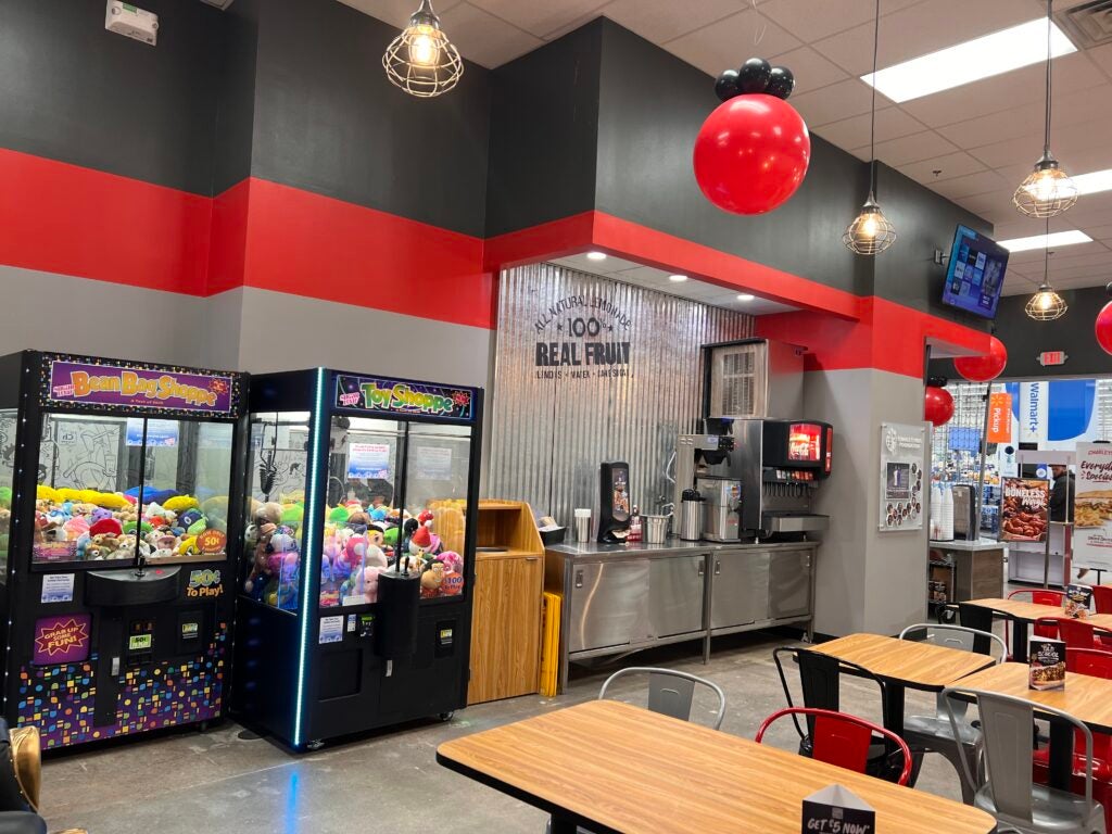 The dining area and drink station at Mesa Stapley Dr. Walmart during the grand opening in December 2022.