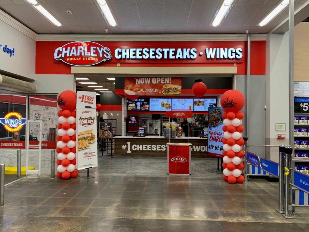 The front entrance of Charleys Cheesesteaks and Wings at Riverdale Walmart during the grand opening in 2023.