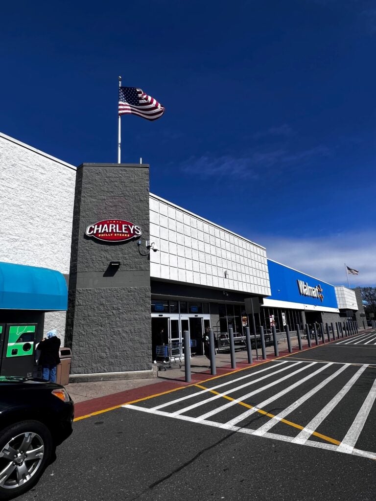 The exterior entrance of Charleys Cheesesteaks and Wings at Centereach Walmart during the grand opening in 2023.