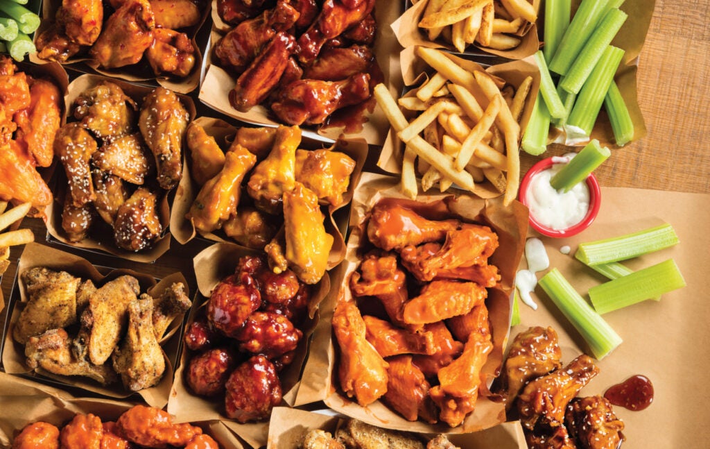 Boneles and classic wings, and original fries with celery and ranch dressing, from Charleys Cheesesteaks and Wings.